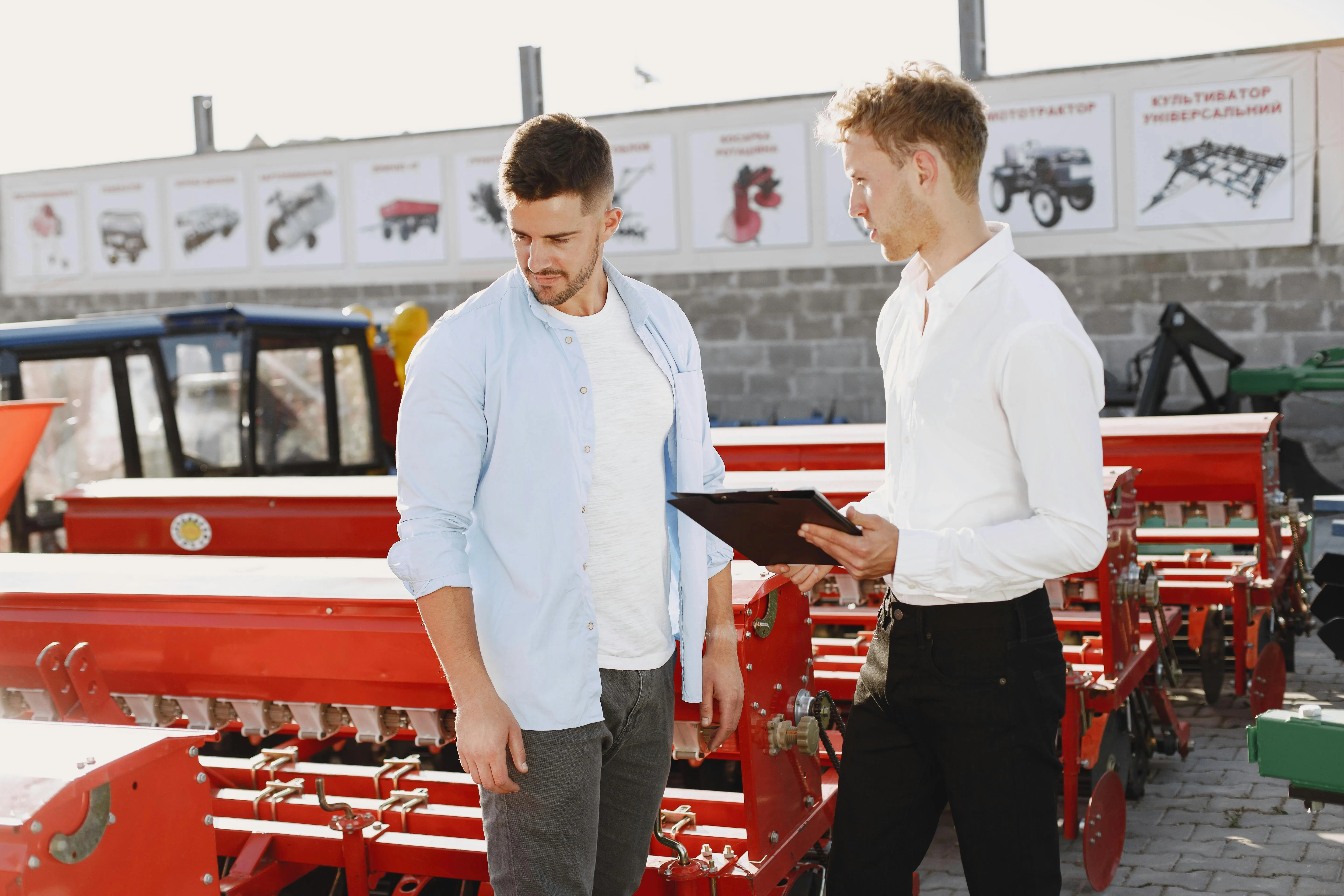 Two business owners reviewing a deal on site
