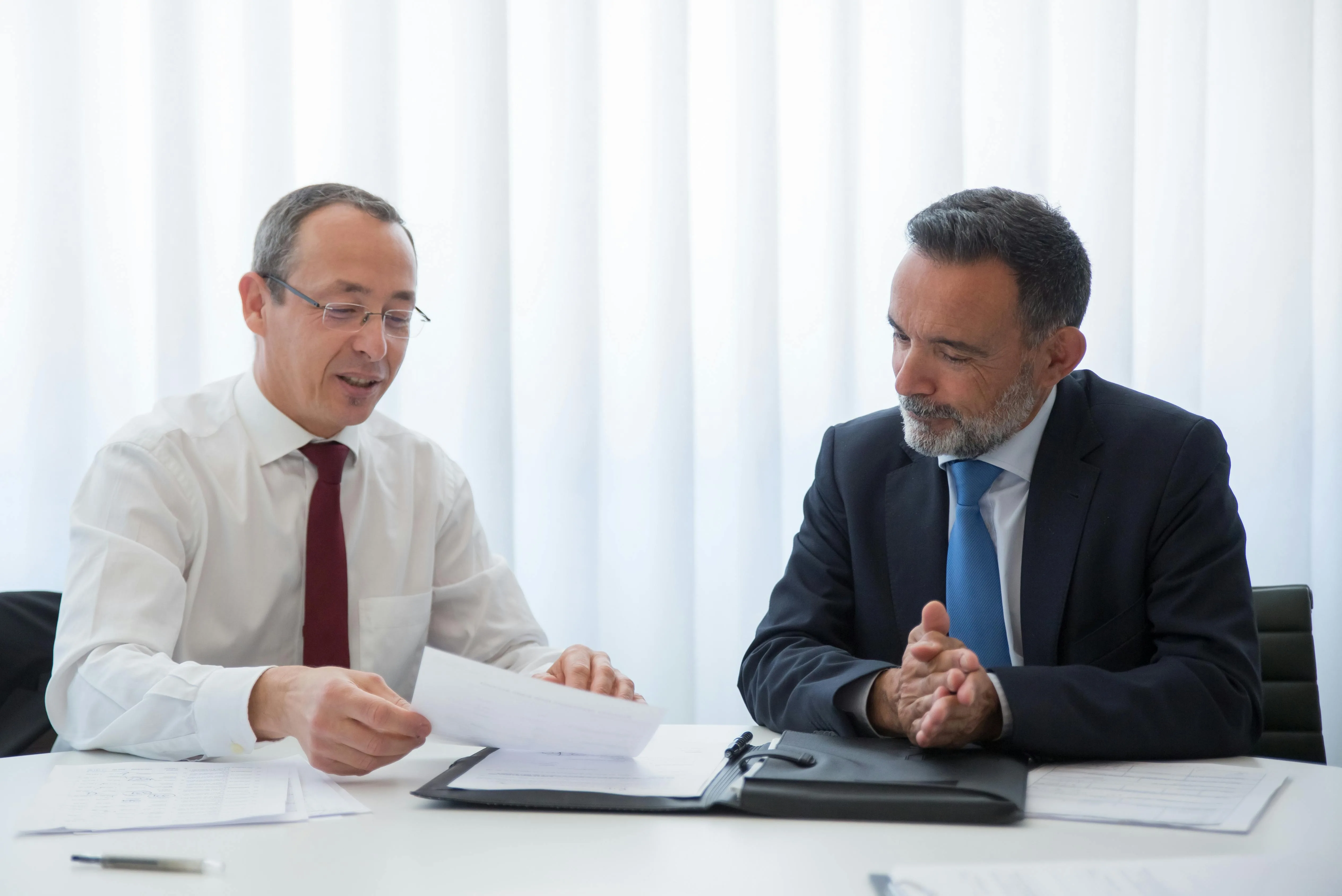 Two business owners reviewing documents