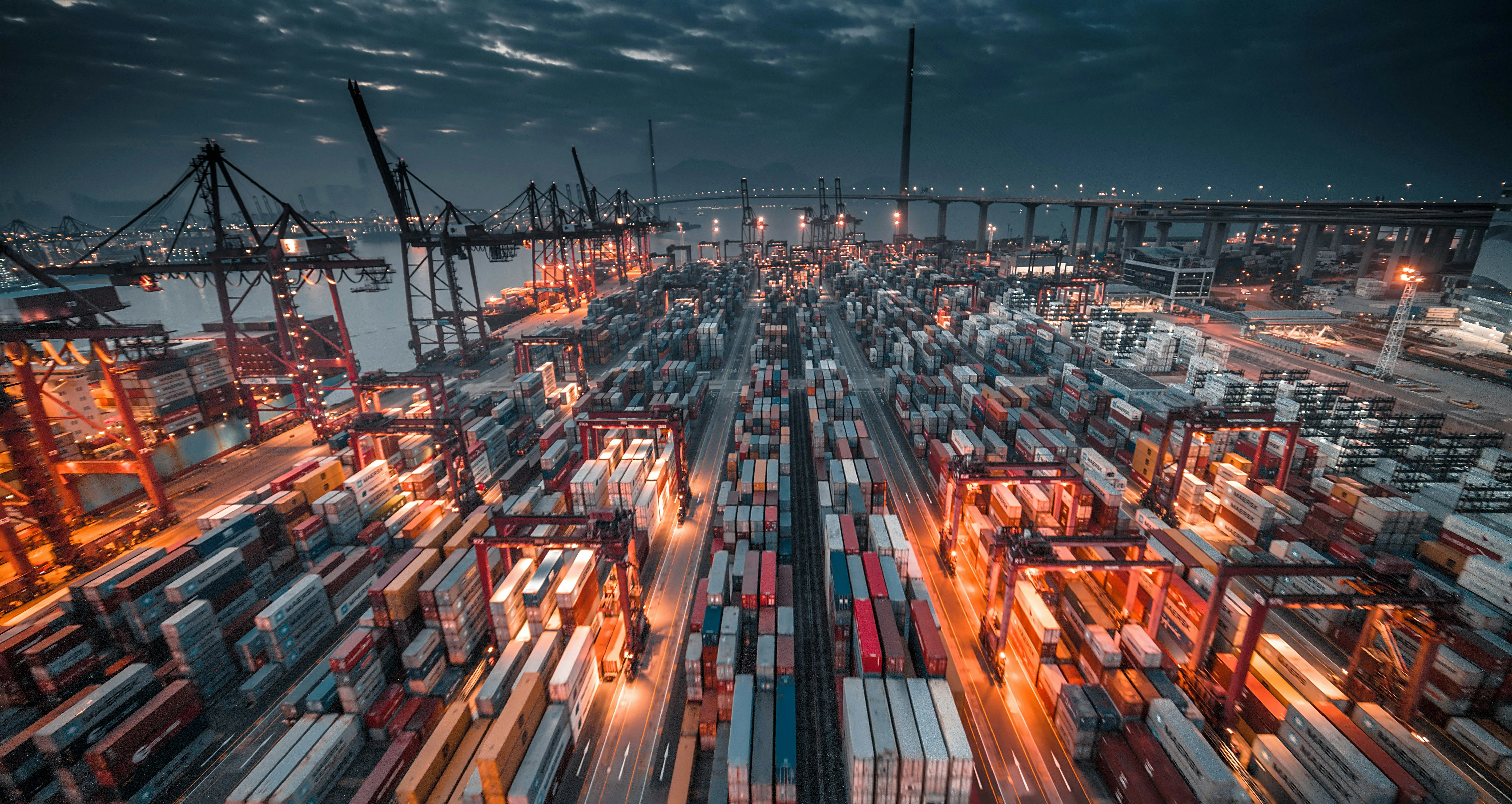 Aerial view of container port with trucks